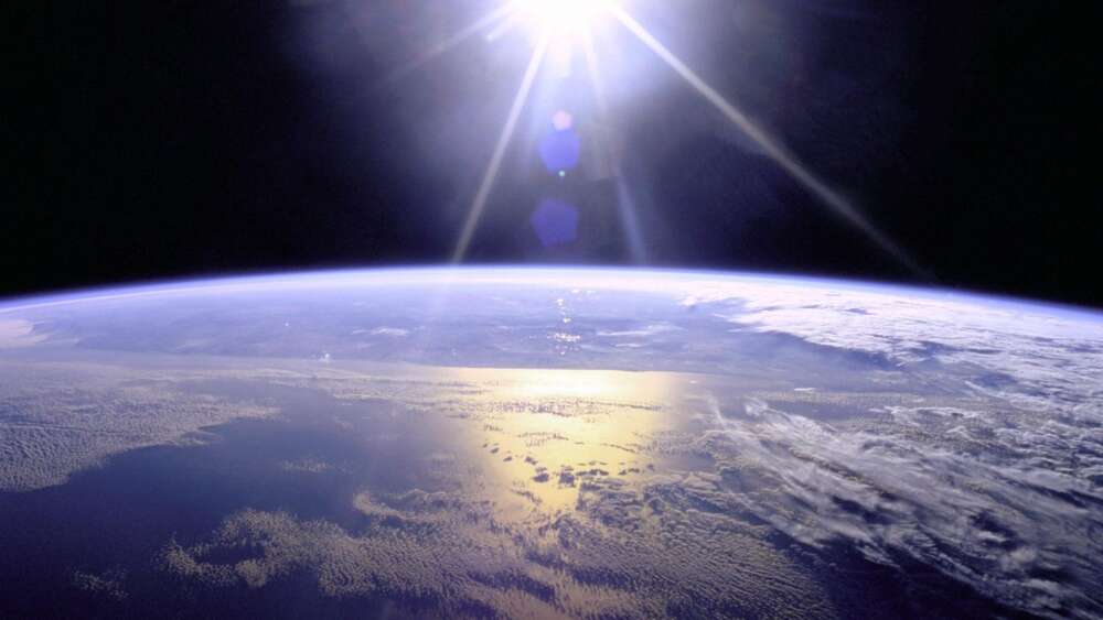 Full Sunburst Over Earth