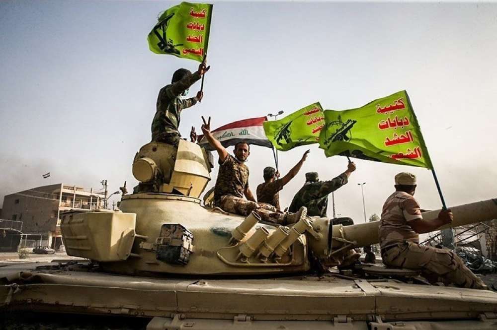 Raising Flag Of Iraq And Popular Mobilization Forces After Defeating Daesh